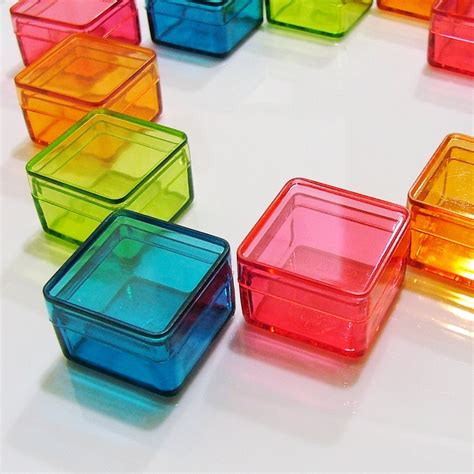 cutting squares out of plastic boxes